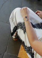 woman multiple silk cord beaded bracelets