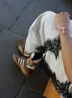 woman multiple silk cord beaded bracelets