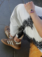 woman multiple silk cord beaded bracelets
