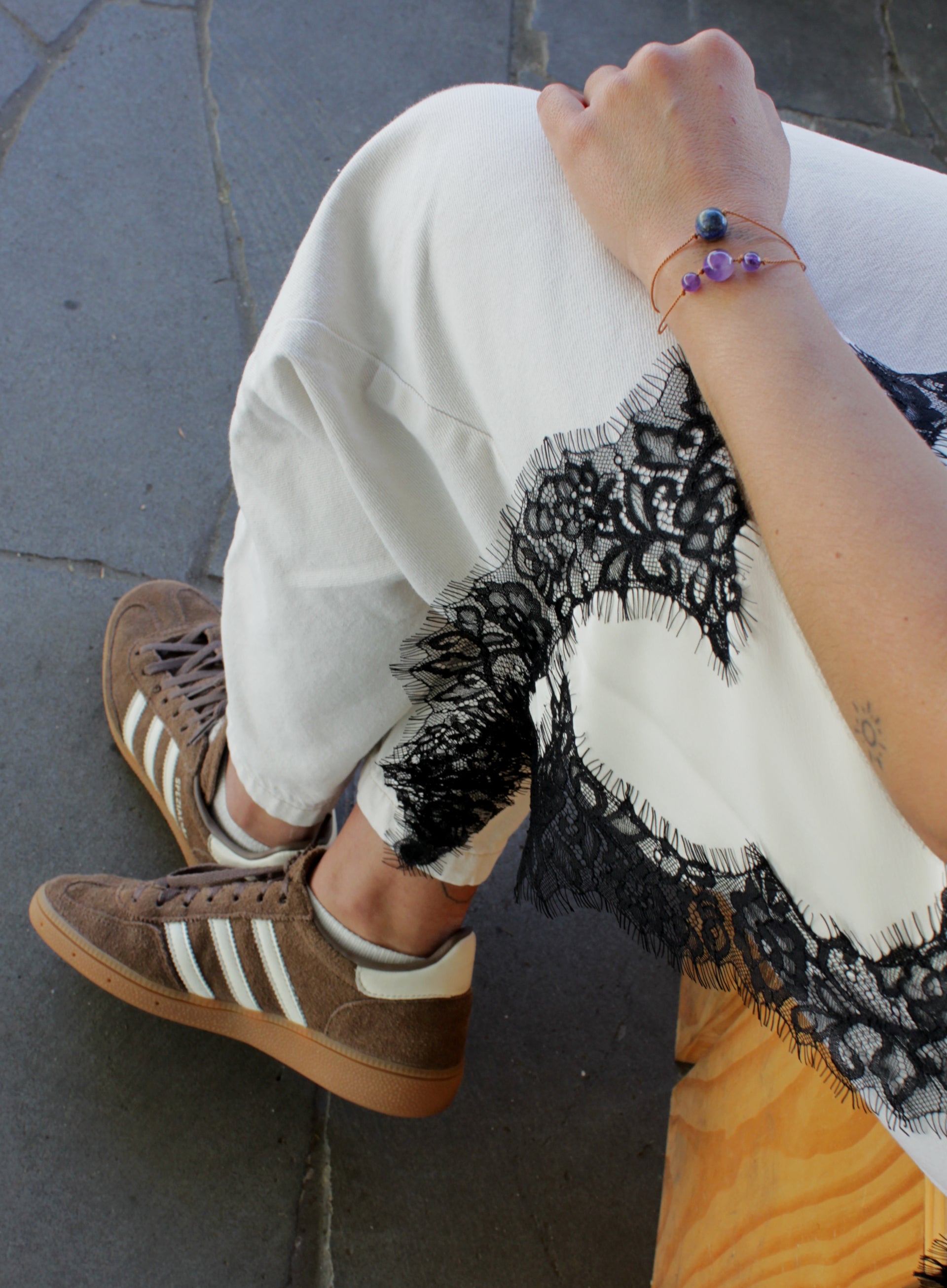 woman multiple silk cord beaded bracelets