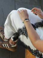 woman multiple silk cord beaded bracelets