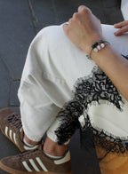 woman multiple silk cord beaded bracelets